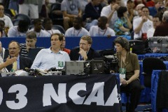 At a pre-game practice at the 2003 NCAA Men’s Final Four in New Orleans where Syracuse won its first NCAA title in its third championship game appearances. Moore is pictured with (L to R) the late legendary Dick Enberg, CBS Sports’ play-by-play announcer Jim Nantz, Pete Moore and Syracuse’s Sue Edson.